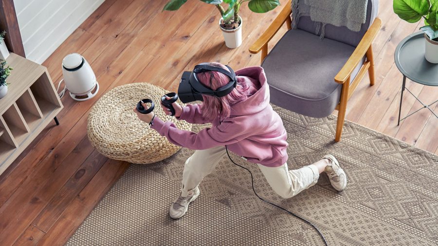 young person playing a physical VR game