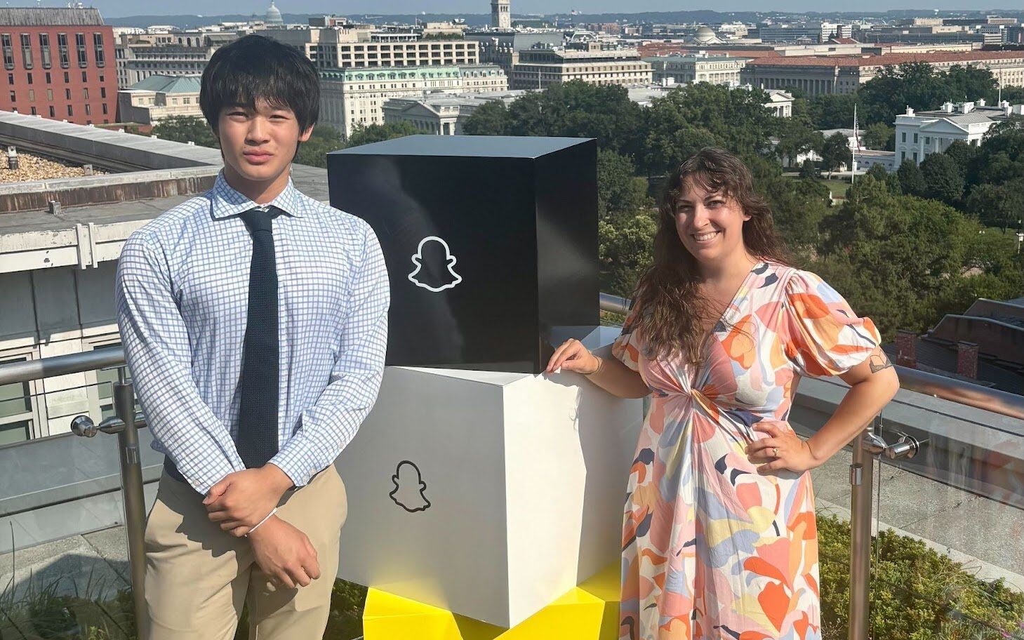 Kaitlin and Jeremy on a sunny rooftop at the event